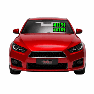 Red car with green chartreuse die cut numbers displayed prominently on the windscreen, showcasing large numerical signage for automotive marketing.
