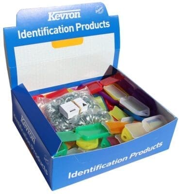 Kevron identification products box containing assorted key tags in multiple colors, designed for automotive dealership supplies and vehicle unveilings.