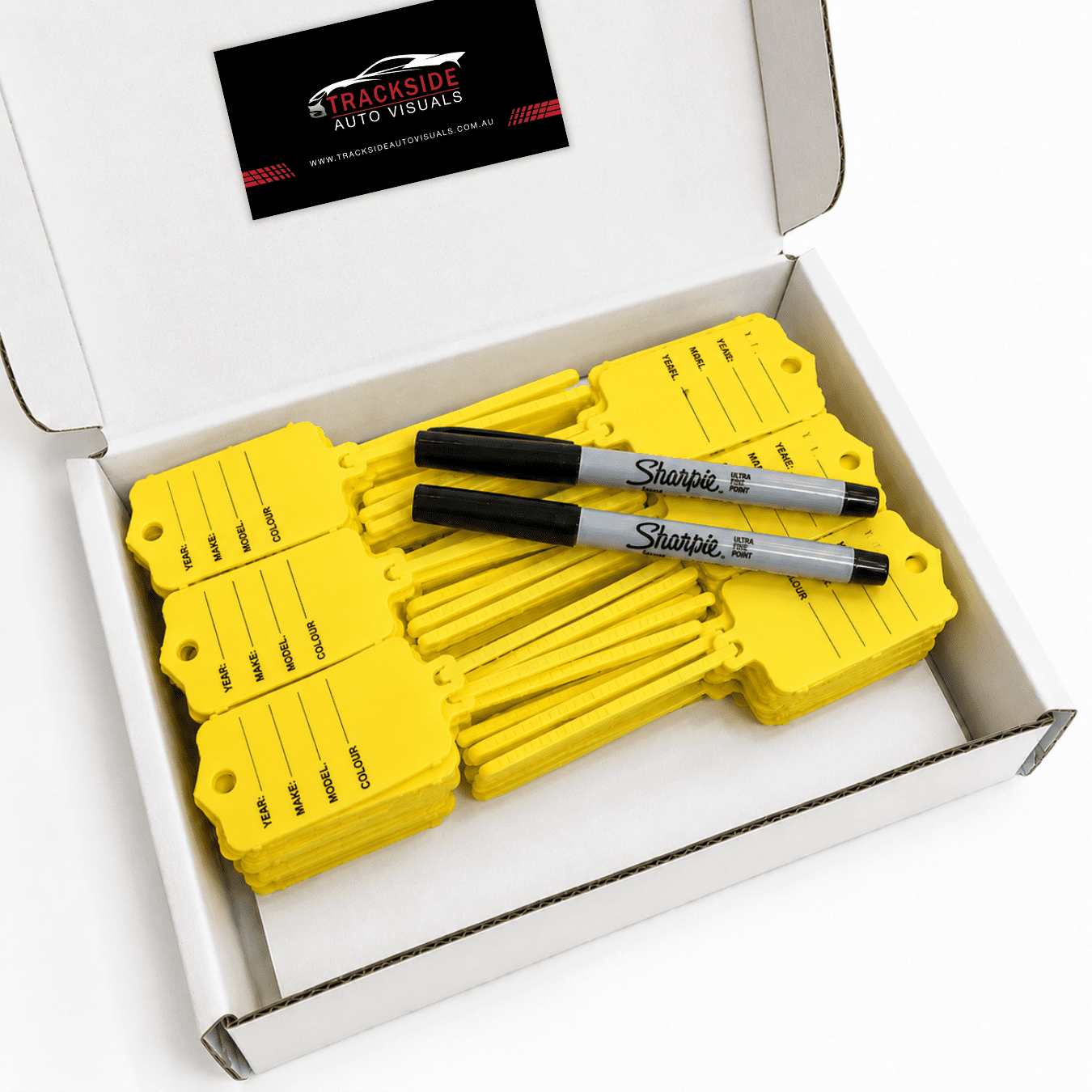 Yellow loop key tags with writing space, two Sharpie markers, and Trackside Auto Visuals branding, presented in a white box.